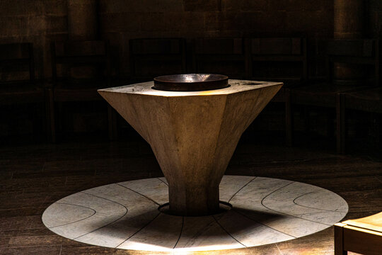 Baptismal font with available light in the church