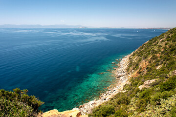 coastline of Sardinia, with blue sea. Mediterranean scrub and typical prickly pear cactus