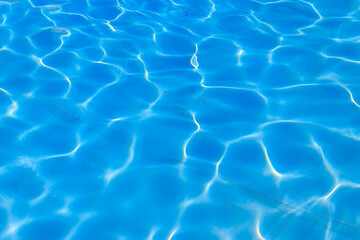 Fototapeta na wymiar Texture of water in swimming pool for background. Surface of blue swimming pool