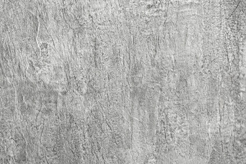 Obraz premium Light background of decorative plaster with abstract spots. Unusual texture of white or gray wall with beautiful patterns, creative surface background. Finishing coating for building cladding.