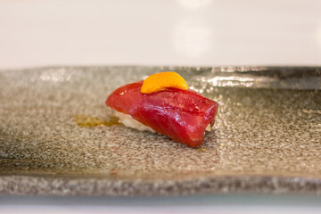 Akami Zuke Nigiri Topping Uni On Japanese Dish With Copy Space.