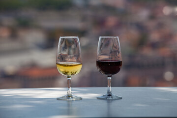 glasses of red and white wine on the table