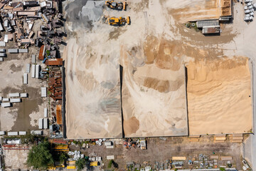 Industrial storage place for sorting and keeping various sands. Aerial view  of industrial technology. 