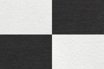 Fototapeta premium Texture of craft black and white paper background with cells pattern, macro. Structure of vintage dense kraft cardboard.
