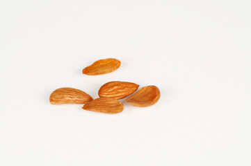 Closeup (Macro) shot of Mamra Giri Almonds on a white background