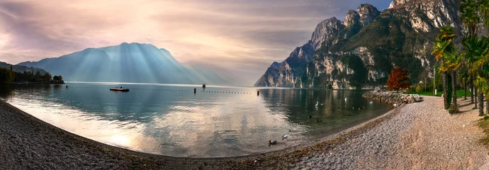 Poster Garda lake. Beautiful morning light in amazing Lago di Garda. Riva del Garda, northern Italy © Freesurf