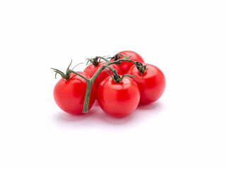 Red ripe fresh cherry tomatoes over a white background