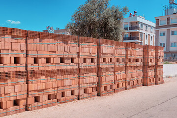 Fototapeta premium A wall made of special hollow bricks designed to keep cool in countries with hot climates. Modern building and construction materials.