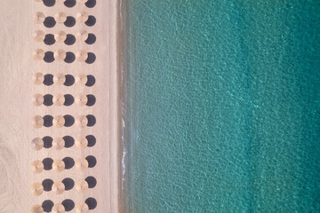 view of the coastline with solar skylights in greece on the mediterranean sea from a drone