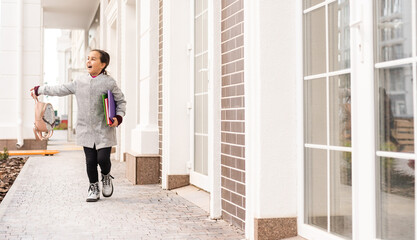 Beautiful young elementary school girl autumn