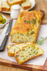 French savoury cake with olives, zucchini, ham and cheese