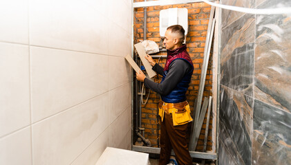 Fototapeta na wymiar industrial tiler builder worker installing floor tile at repair renovation work.