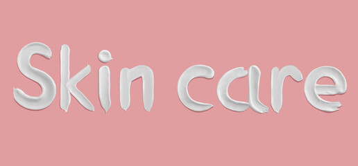 Skin care word written with cream texture smears on pink background