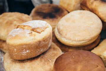Lots of homemade bread. buns from flour baking. grain shortage.