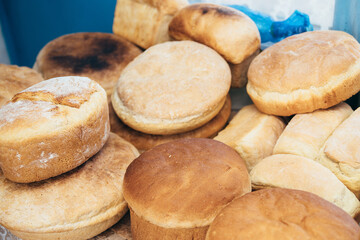Lots of homemade bread. buns from flour baking. grain shortage.