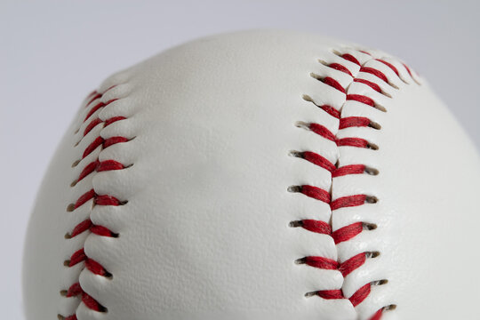 A Closeup of a Baseball in a White Background