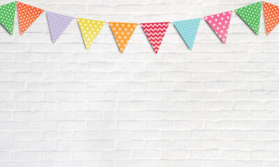 Colorful party flags hanging on white wall background, birthday, anniversary, celebration event, festival greeting card background