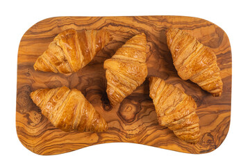 Fresh flavorous croissant on wooden table isolated on white