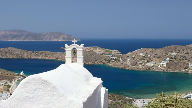 Panoramic view of an orthodox church and the beautiful port of Ios in Greece