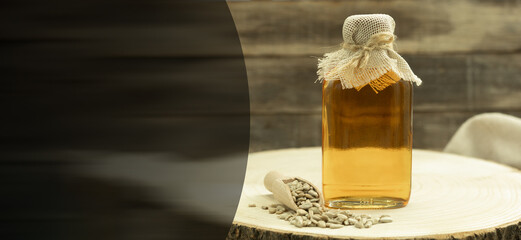 Bottle with fragrant sunflower oil and background with space for text