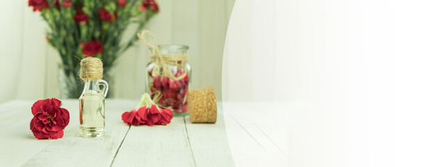 A bottle of aromatic oil made from fresh flower petals