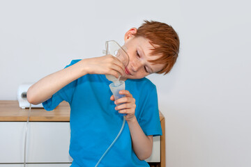 The child collects a nebulizer for inhalation. The concept of cough treatment, covid19.