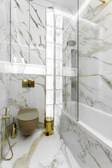 Marble tile wall and marble sink, luxury bathroom interior.