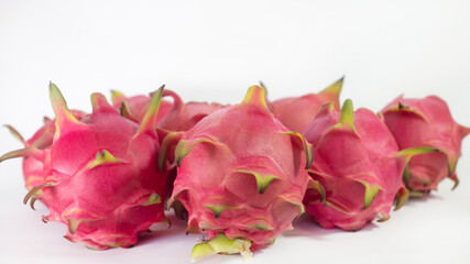 RED PITAHAYA DRAGÓN FRUIT ON A WHITE BACKGROUND WITH SPACE FOR TEXT, HEALTHY DIET WITH EXOTIC TROPICAL FRUITS © Victor Photo Stock