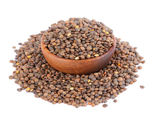 French lentils in wooden bowl, isolated on white background. Dry puy lentil grains pile.