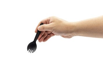 A man's arm holds a small disposable black plastic fork