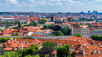 Fototapeta na wymiar Old town of Prague. Czech Republic over river Vltava with Charles Bridge on skyline. Prague panorama landscape view with red roofs. Prague view from Petrin Hill, Prague, Czechia.