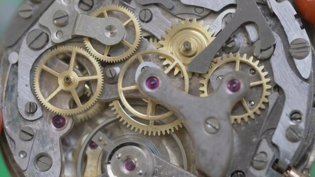 Vintage watch mechanism gear motion, macro close-up