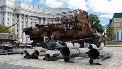 Exploded Russian projectiles of rocket systems and destroyed vehicle in Kyiv.  War in Ukraine