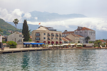 Obraz premium Beautiful Mediterranean landscape. Montenegro. View of Tivat city on cloudy spring day