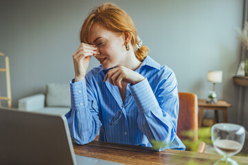 Tired fatigued young woman massaging stiff neck rubbing tensed muscles hurt to relieve back joint...