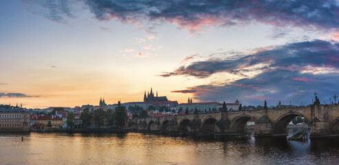 View of Prague Castle and Charles Bridge at sunset. Czechia