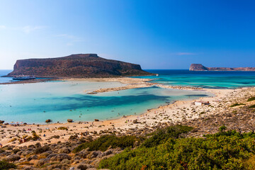 Obraz premium Amazing beach with turquoise water at Balos Lagoon and Gramvousa in Crete, Greece. Cap tigani in the center. Balos beach on Crete island, Greece. Landscape of Balos beach at Crete island in Greece.
