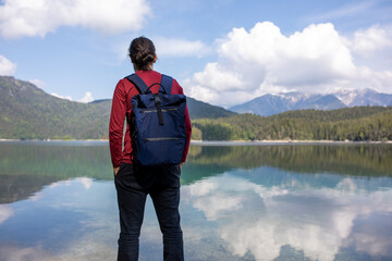 Fototapeta premium Man near the lake in the mountains