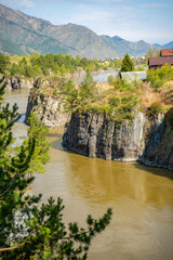 Obraz premium View from bridge to Patmos Island with a monastery church, landmark in the Altai Territory, Russia