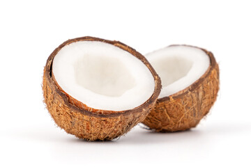 Fresh and tasty coconuts cut in half, healthy food, close-up with small depth of field isolated