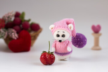 A small knitted mouse toy. Hand made