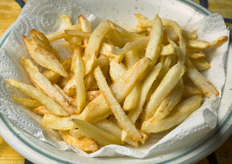 Garrison. French fries on a plate with greaseproof paper
