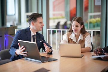 Business people in the workplace are discussing a working strategy for doing business