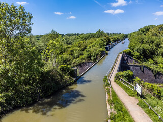 Fototapeta premium An aerial view across the Iron Trunk aqueduct and the Grand Union canal at Wolverton, UK in summertime