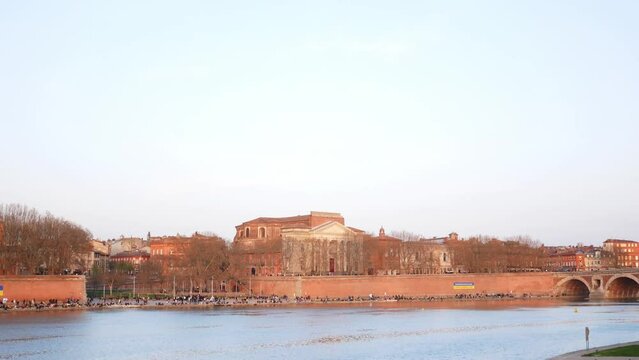 Tilt down view of Notre Dame de la Daurade basilica and Garonne river in Toulouse