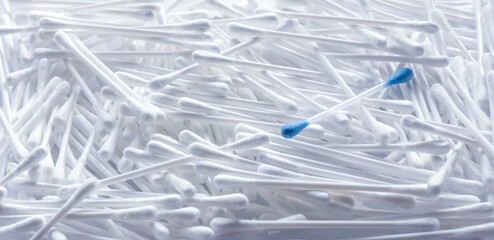 Pile of cotton swabs as a background.