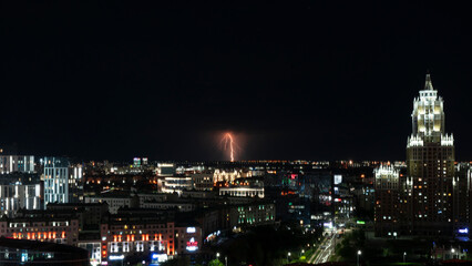 Fototapeta na wymiar Lightning over the city at night. City out of focus. High quality photo