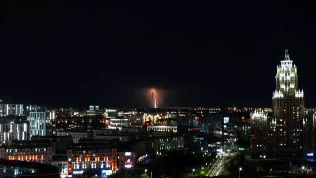 Lightning over the city at night. City out of focus. High quality photo