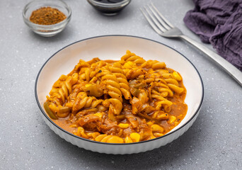 Red sauce pasta slow-cooked in tomato sauce, prepared with flavourful spices