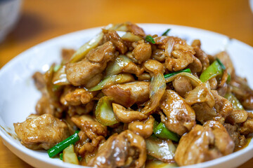 A delicious Chinese home-style dish, fried chicken thighs in Beijing green onion sauce